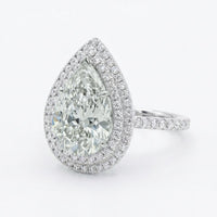 7.03 Ct Pear Diamond, Natural, K SI2 set with 1.18Ct Dia, 18k Gold